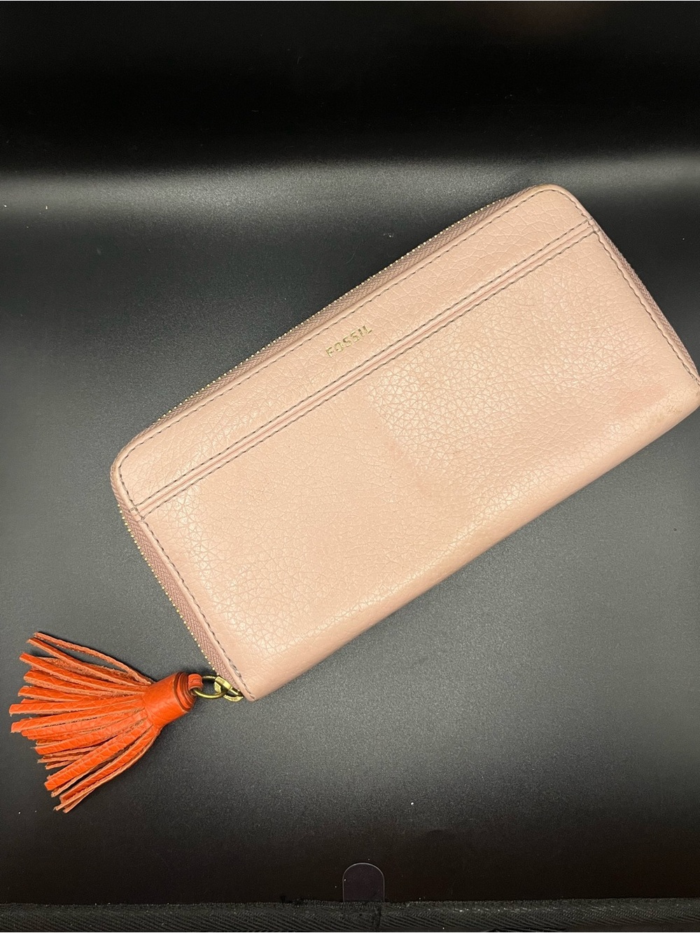 Fossil Blush Leather Zip Wallet with Orange Tassel Accent